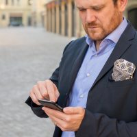 Phone, business, person — Enhancing Performance and Recovery with Dr. James Morales Expertise