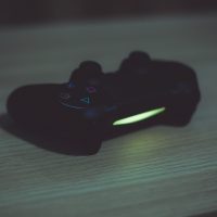 Playstation, controller, video games — Exploring Live Dealer Games at Online Casinos: A Comprehensive Guide